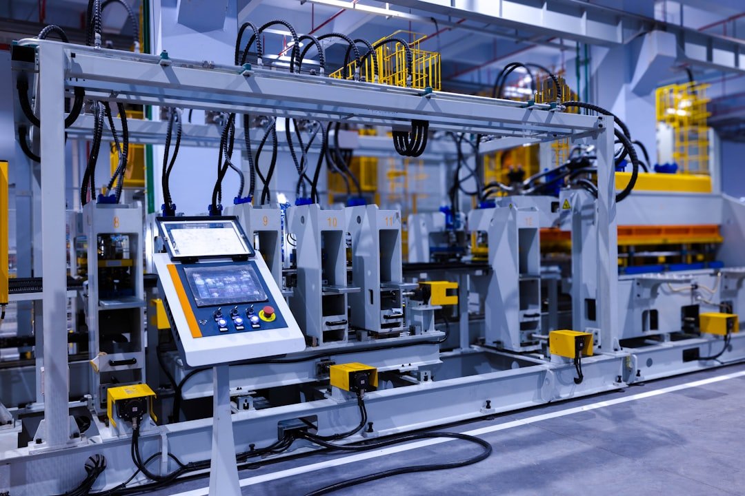 A view of the refrigerator manufacturing plants fully automated side panel forming line.Translation: Warning:Danger Prohibit reach into;elecric shock;must connect an earth terminal to the ground