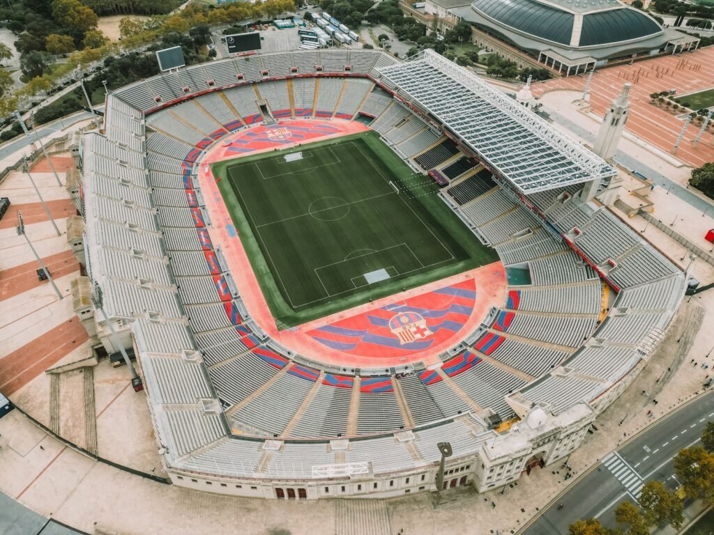 Photo by Igor Batista an aerial view of a stadium with a soccer field