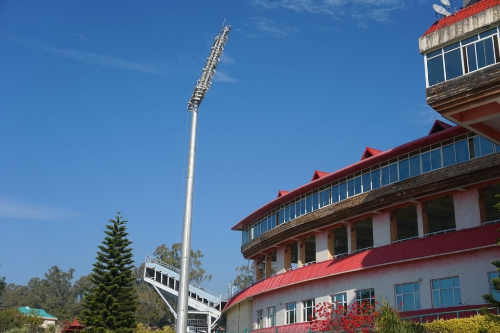Photo by Piyush Bansal red and white concrete building under blue sky during daytime