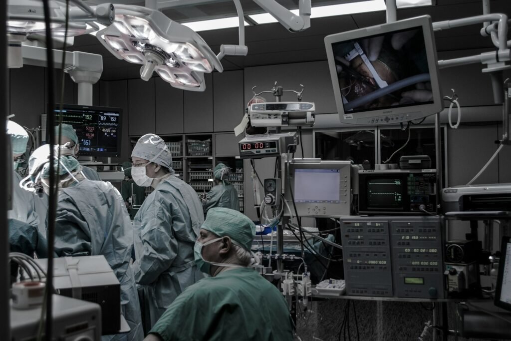 Photo by Piron Guillaume people wearing surgical clothes inside operating room