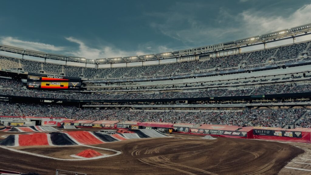 Photo by Yucel Moran a view of a dirt bike track in a stadium